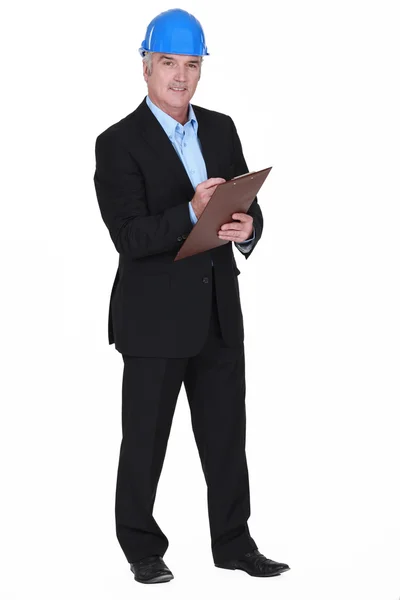 Portrait of middle-aged architect holding clipboard — Stock Photo, Image