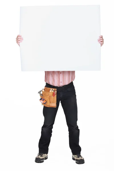 Man covering his face with a blank sign — Stockfoto
