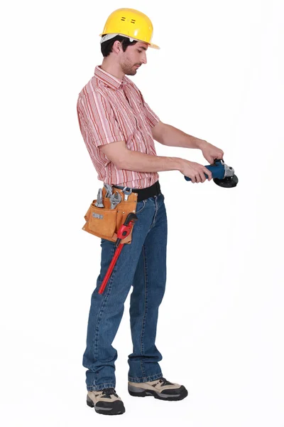 Manual worker stood with angle grinder — Stock Photo, Image