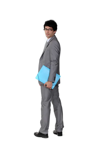 A suave businessman holding a file — Stock Photo, Image