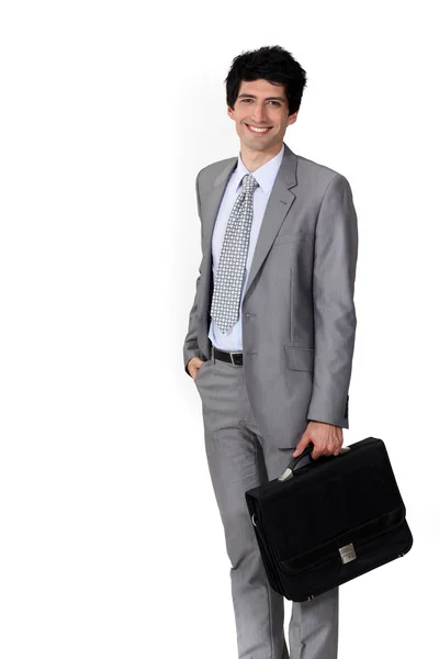 Een gelukkig zakenman met een werkmap. — Stockfoto