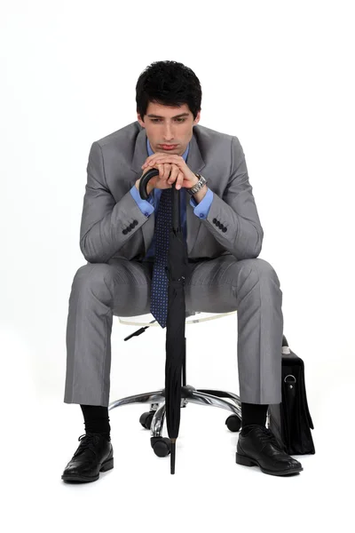 Депресивний бізнесмен на стільці . — стокове фото