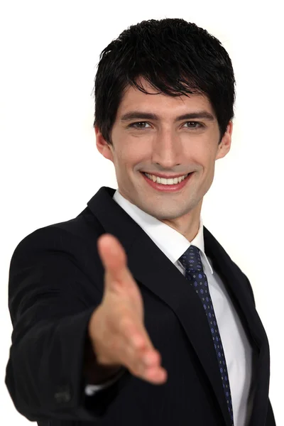 Young businessmen offering hand — Stock Photo, Image
