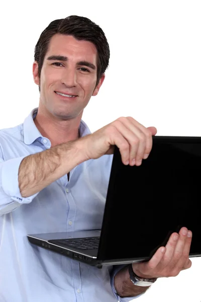 Homem de negócios com um laptop — Fotografia de Stock