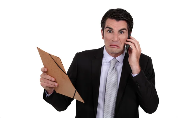 An angry businessman over the phone. — Stock Photo, Image
