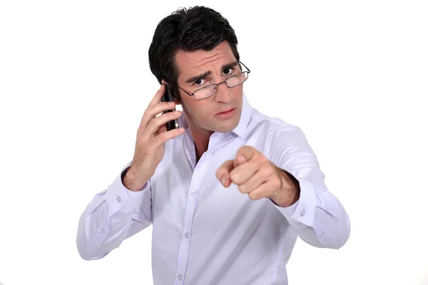 Angry businessman pointing at the camera — Stock Photo, Image