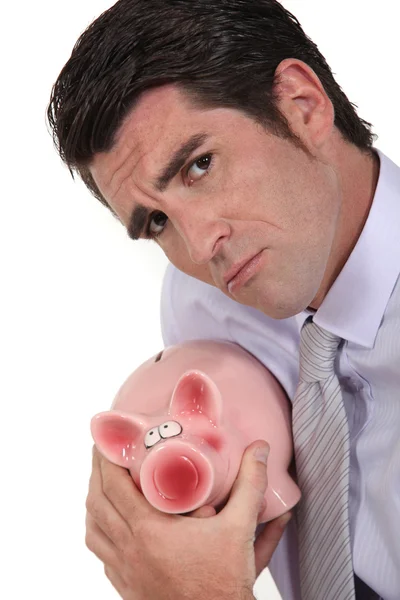 Empresário com banco porquinho — Fotografia de Stock