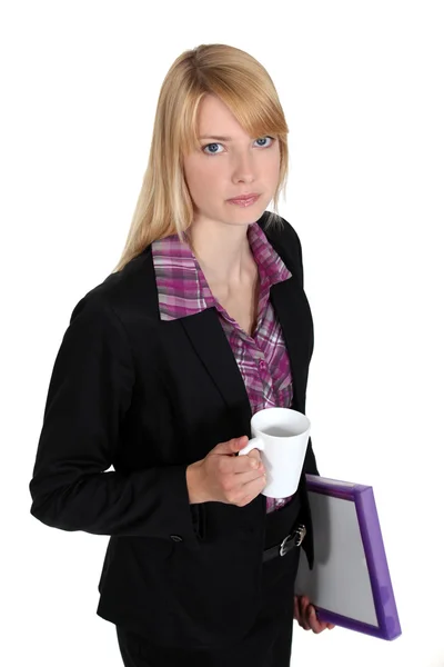 Businesswoman holding a cup of coffee — Stock Photo, Image