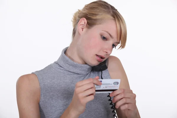 Woman with credit card and phone — Stock Photo, Image
