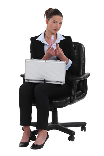 Woman with a briefcase full of money — Stock Photo, Image