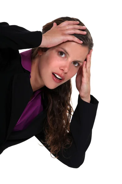 Geschokt zakenvrouw met handen op het hoofd — Stockfoto