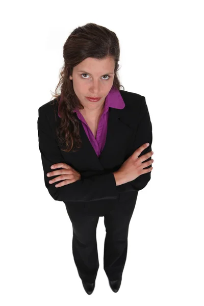 Cross-armed woman with straight face — Stock Photo, Image