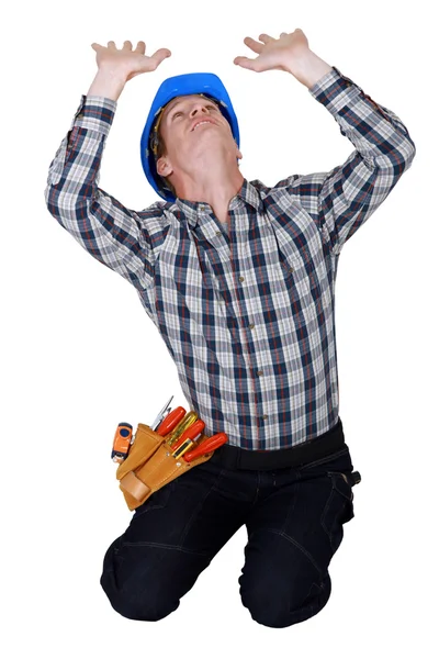 A construction worker being crushed. — Stock Photo, Image