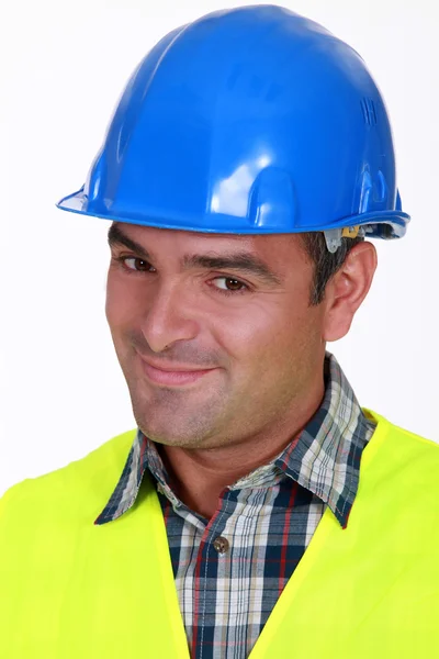 Close-up shot of a smiling tradesman — Stock Photo, Image
