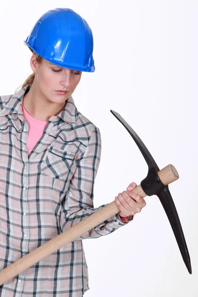 Woman with a pickaxe — Stock Photo, Image