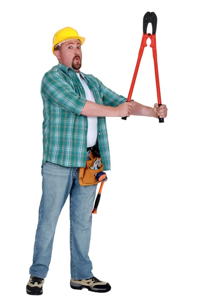 Construtor com um par de cortadores de parafuso — Fotografia de Stock