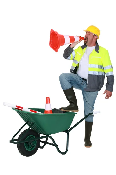 Builder shouting through cone — Stock Photo, Image