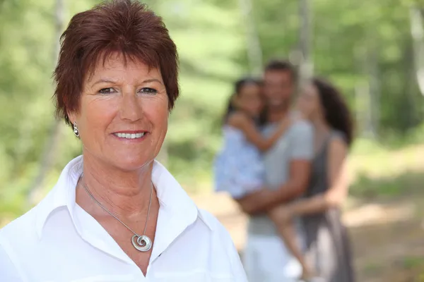 Grandmother enjoying a day out with her family — Stock Photo, Image