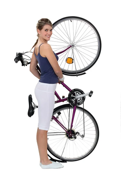 Brunette stood with bicycle — Stock Photo, Image