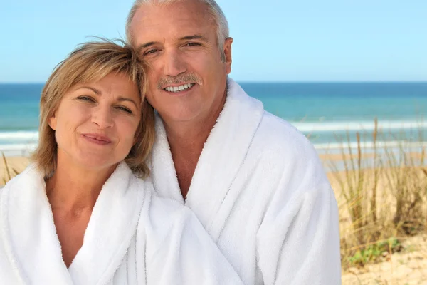 Mature couple in bathrobe Stock Photo