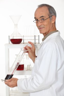 Winemaker analyzing wine clipart