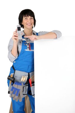 A female artisan showing a cell phone clipart
