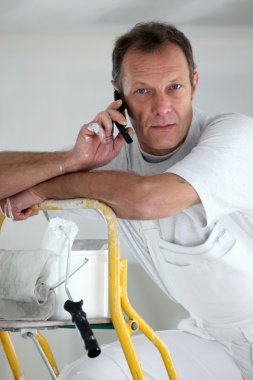 Portrait of a painter on the phone clipart