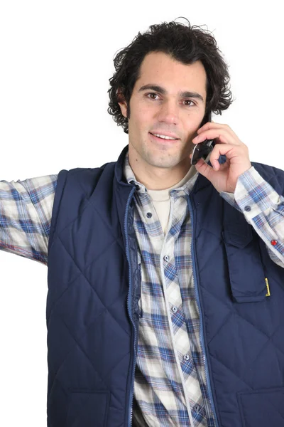 Workman using a cellphone — Stock Photo, Image