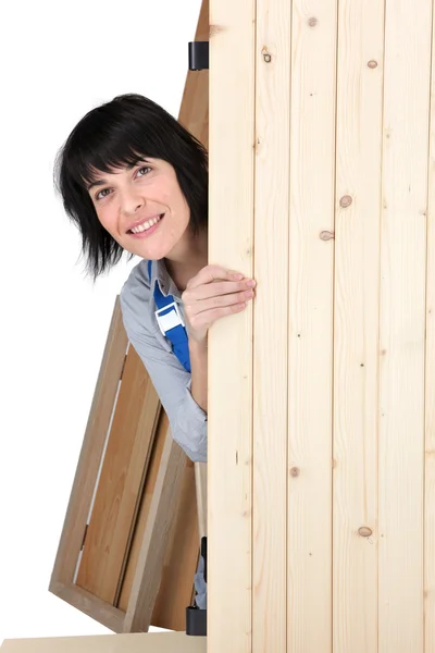 Woman hidden behind wooden plank — Stock Photo, Image