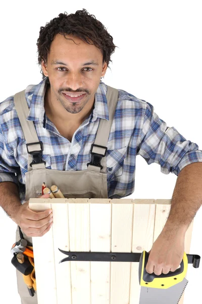 Carpenter with a saw — Stock Photo, Image