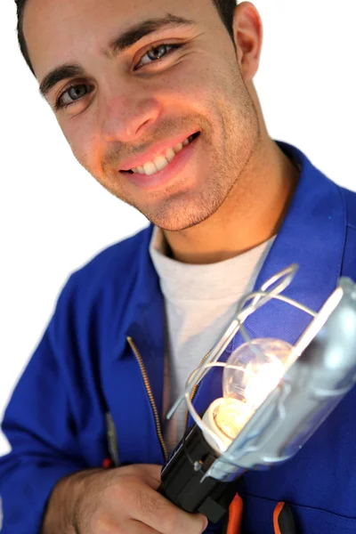 Electrician holding lamp — Stock Photo, Image
