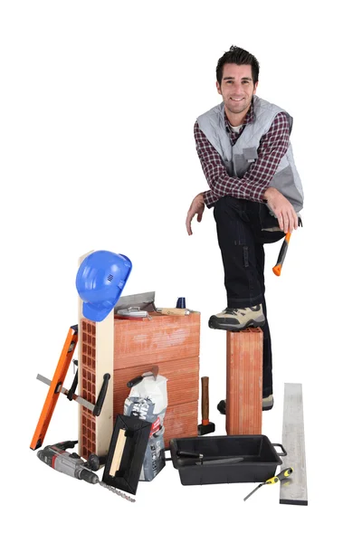 Casual mason stood by his equipment — Stock Photo, Image