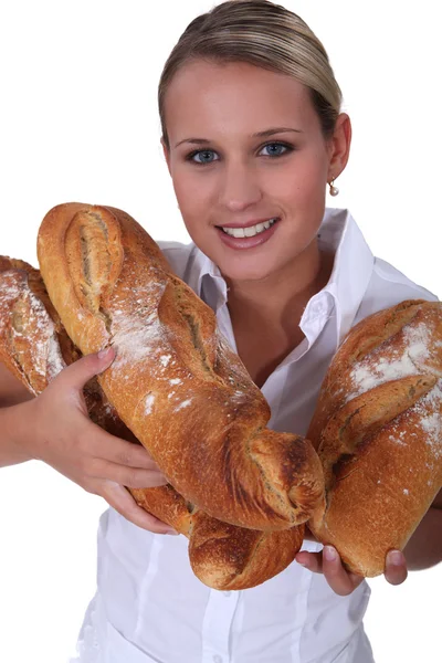 Baker with loaves of bread — Stock Photo, Image