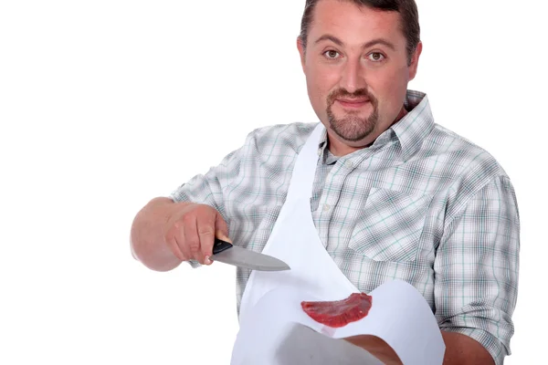 Butcher offering a piece of steak — Stock Photo, Image