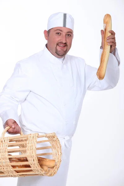 Padeiro com pão — Fotografia de Stock