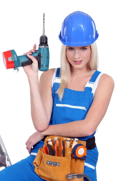 Sexy craftswoman holding a drill Royalty Free Stock Images