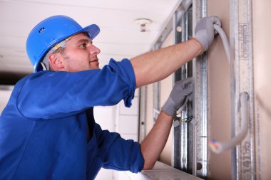 Electrician installing wiring clipart