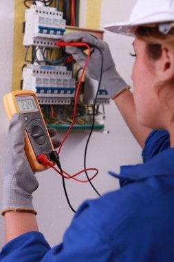 Female electrician with voltmeter clipart