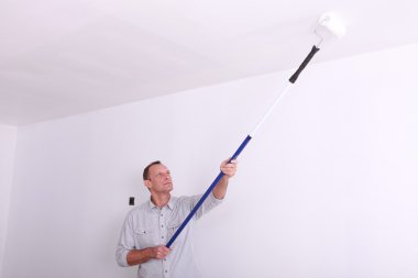 Man painting ceiling clipart