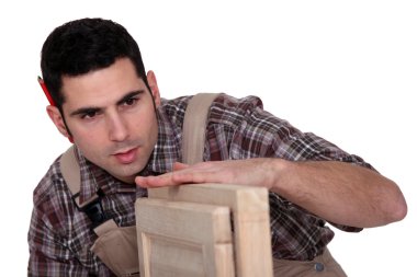 Carpenter with cabinet doors clipart