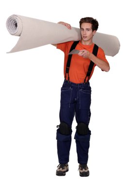 Man carrying roll of carpet clipart
