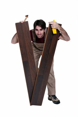 Floorer stood with two planks clipart