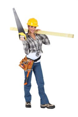 Woman carrying a handsaw and timber clipart