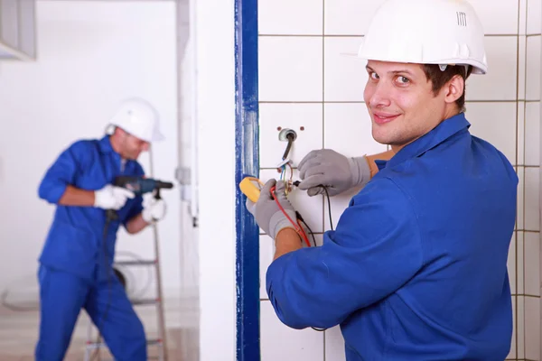 Two electricians' work — Stock Photo, Image