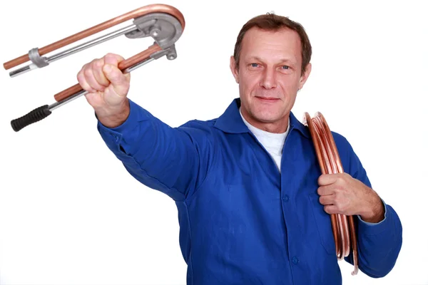 Plumber with copper tube — Stock Photo, Image