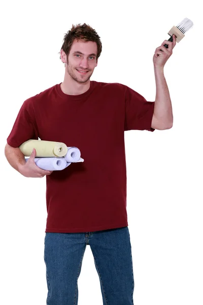 Een man klaar om te poseren wand papier. — Stockfoto