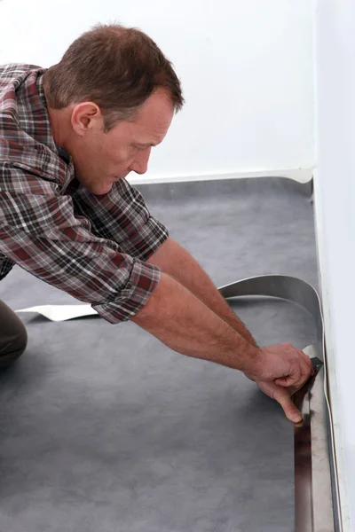 Hantverkare som täcker golvet — Stockfoto