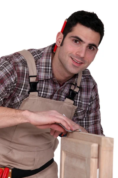 Woodworker finishing a window frame — Stock Photo, Image