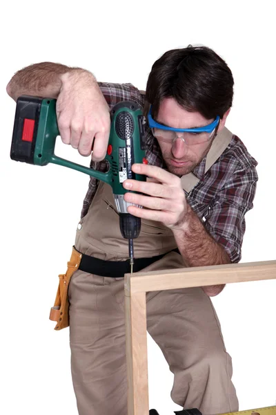 Man using an electric screwdriver — Stock Photo, Image