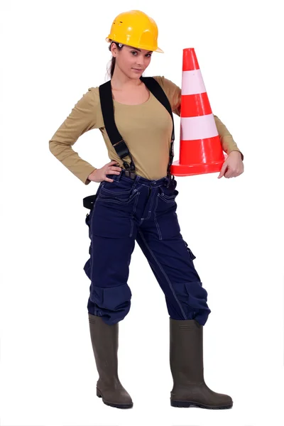 Woman holding traffic cone — Stock Photo, Image